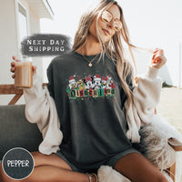 a woman sitting on a couch holding a cup of coffee