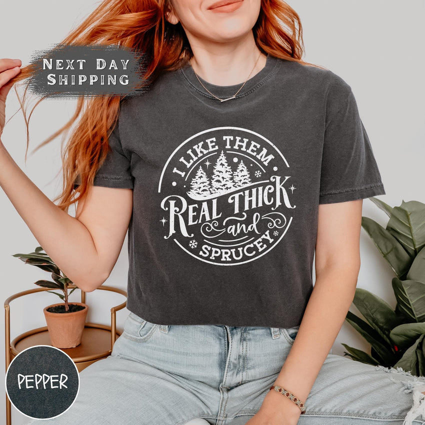 a woman wearing a t - shirt that says, like them, real thick and