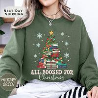 a woman wearing a green sweatshirt with a christmas tree on it