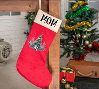 a christmas stocking hanging from a wooden table