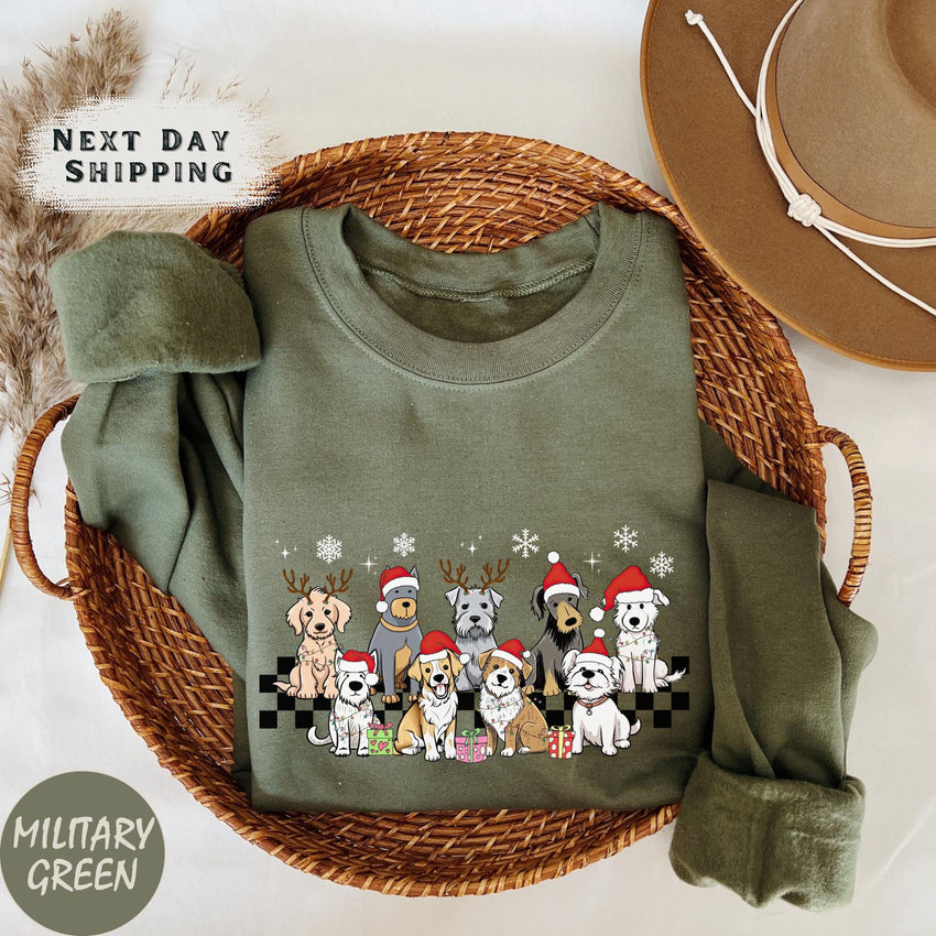 a sweater with dogs on it next to a hat