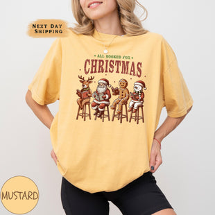 a woman wearing a yellow christmas t - shirt