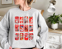 a woman sitting on a couch wearing a coca - cola sweatshirt