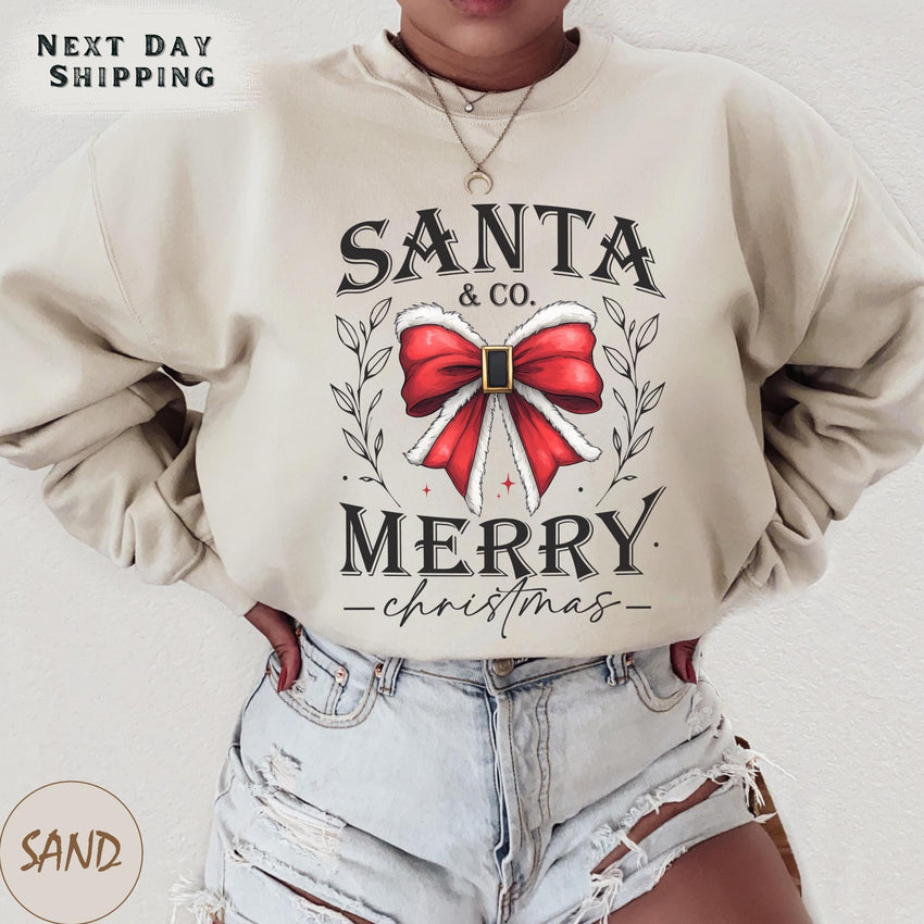 a woman wearing a santa and merry sweatshirt