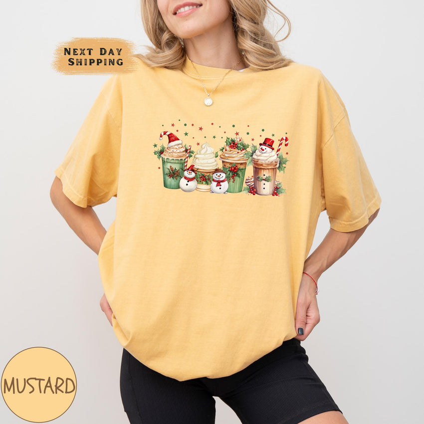 a woman wearing a yellow shirt with cupcakes on it