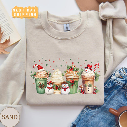 a sweater with a picture of a coffee cup with frosting and a snowman