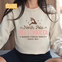 a woman wearing a sweatshirt with a reindeer on it