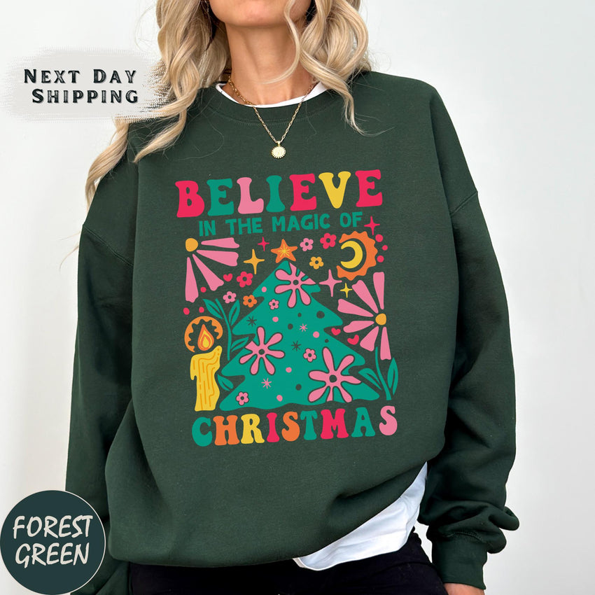 a woman wearing a green sweatshirt with a christmas tree on it