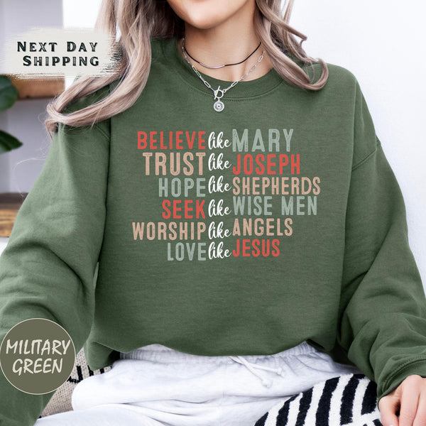 a woman wearing a sweatshirt that says believe the mary trust the joseph hope the shepherd